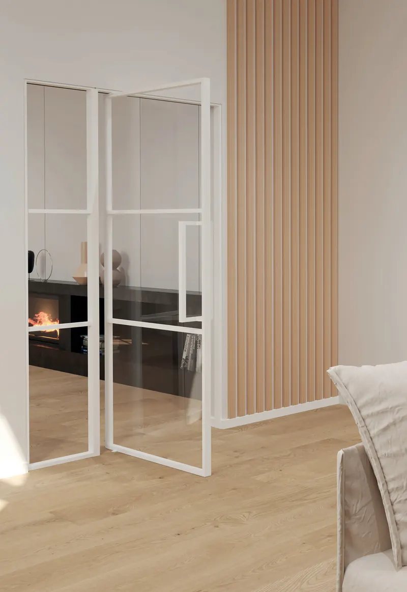 LOBO Stahl-Loft-Tür mit weißem Rahmen und Glasfeldern, eingebaut im Wohnraum